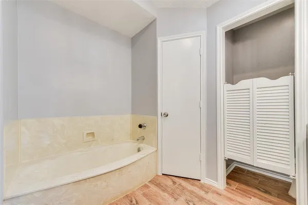 a view of a hallway with closet