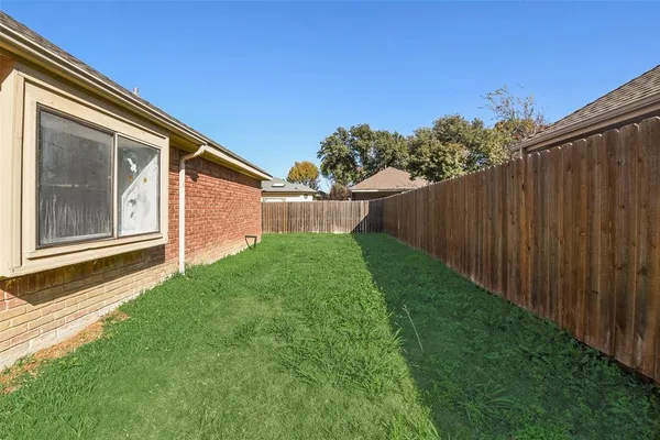 a backyard of a house with lots of green space