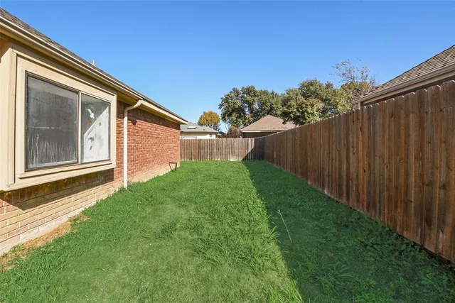 a backyard of a house with lots of green space