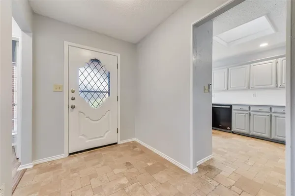 a view of a kitchen with electric appliances
