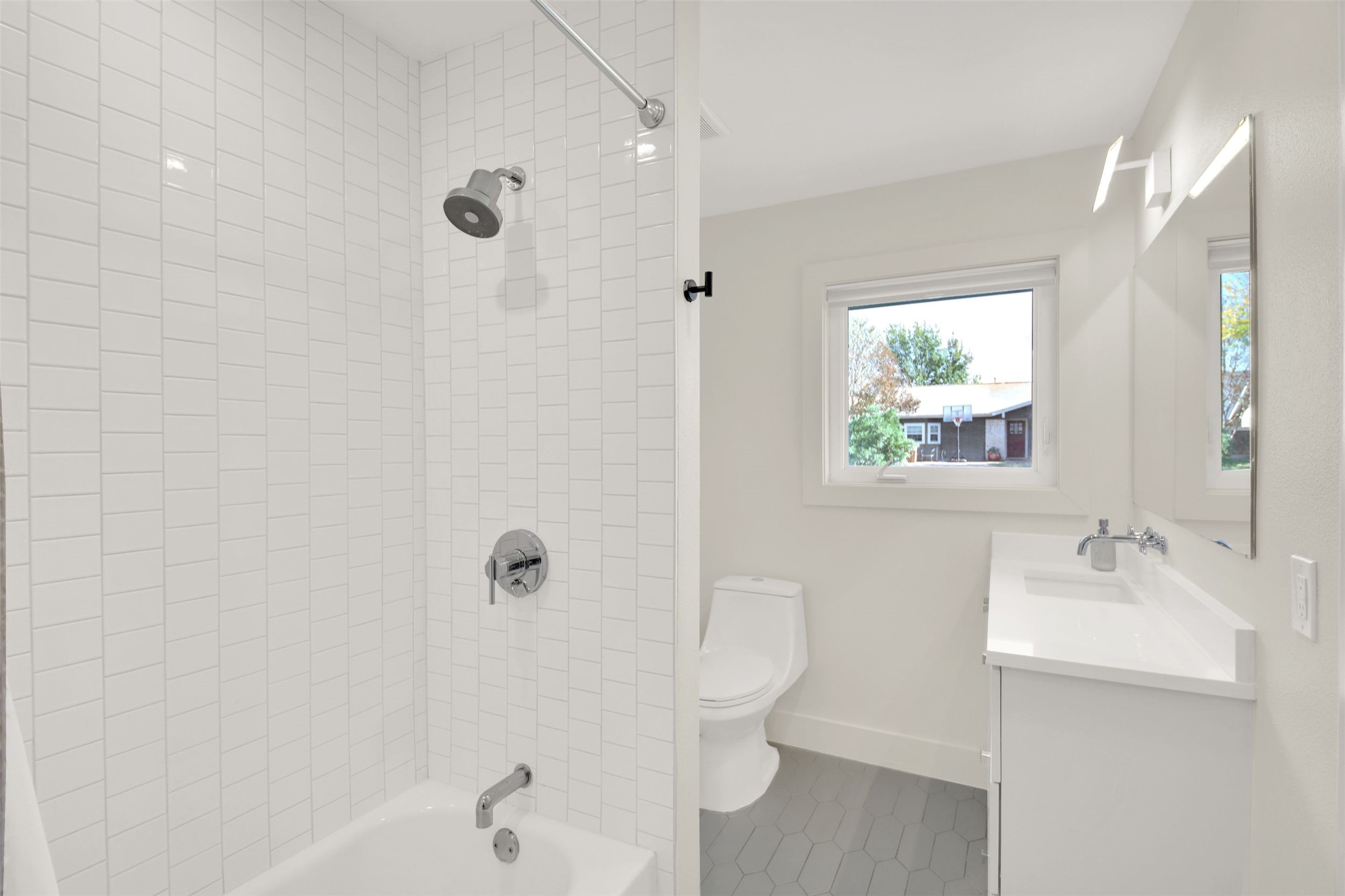 7510 Daugherty Street Austin, TX 78757 - Photo 14 of 37 Full bathroom featuring vanity and shower / bath combination