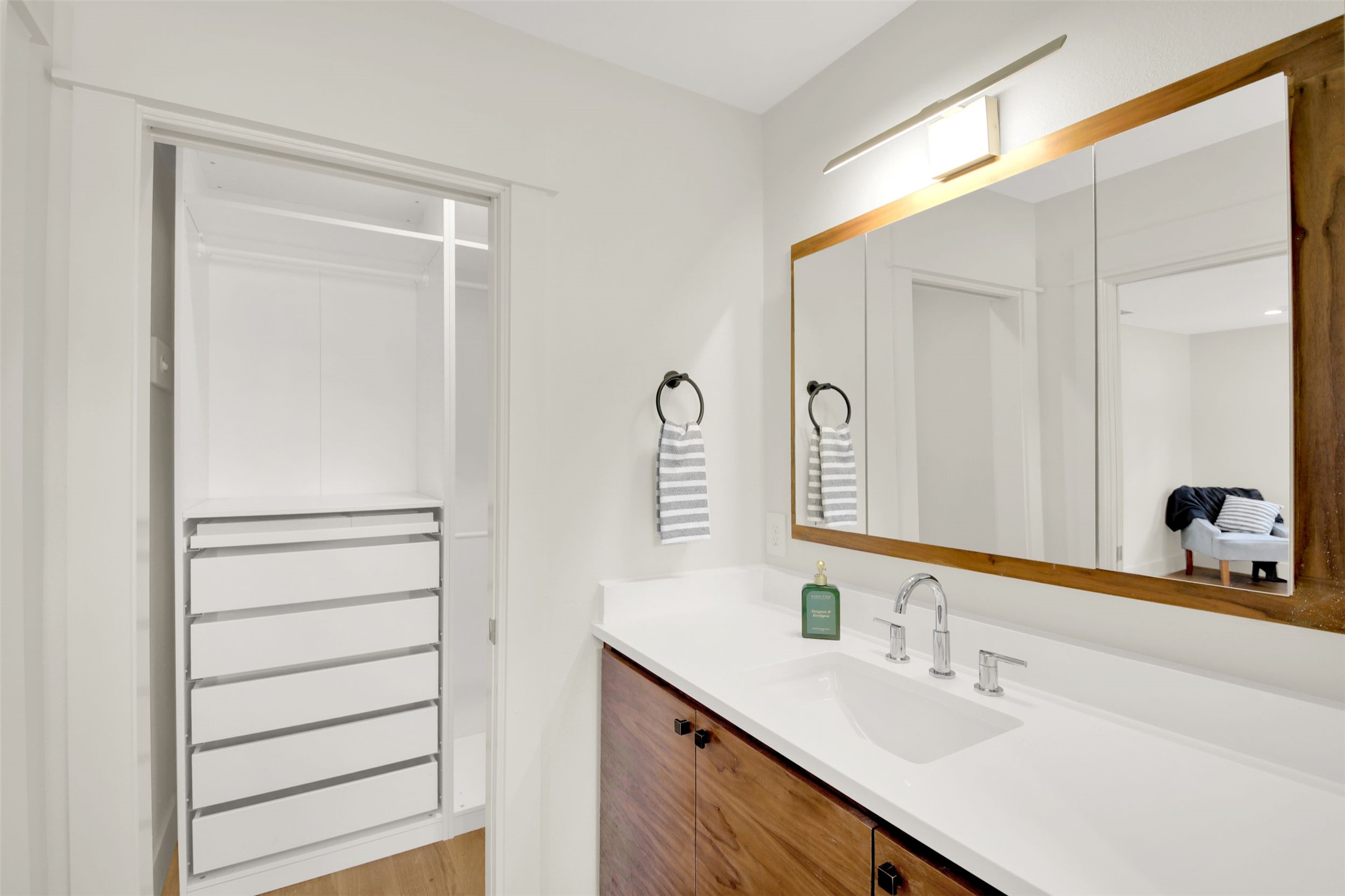 7510 Daugherty Street Austin, TX 78757 - Photo 17 of 37 Bathroom featuring vanity and light wood-style floors