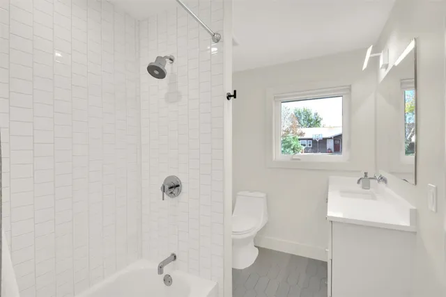 a bathroom with a shower and a sink