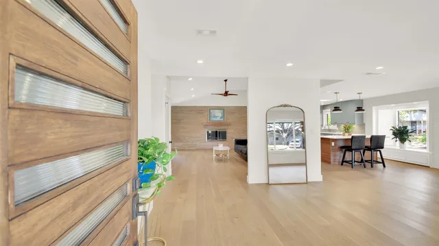 a kitchen with furniture and a potted plant