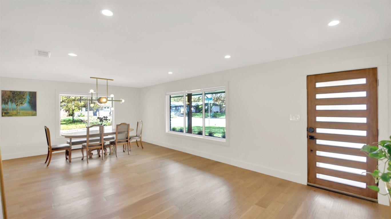 7510 Daugherty Street Austin, TX 78757 - Photo 8 of 37 Dining space with light wood-type flooring, plenty of natural light, recessed lighting, and a chandelier