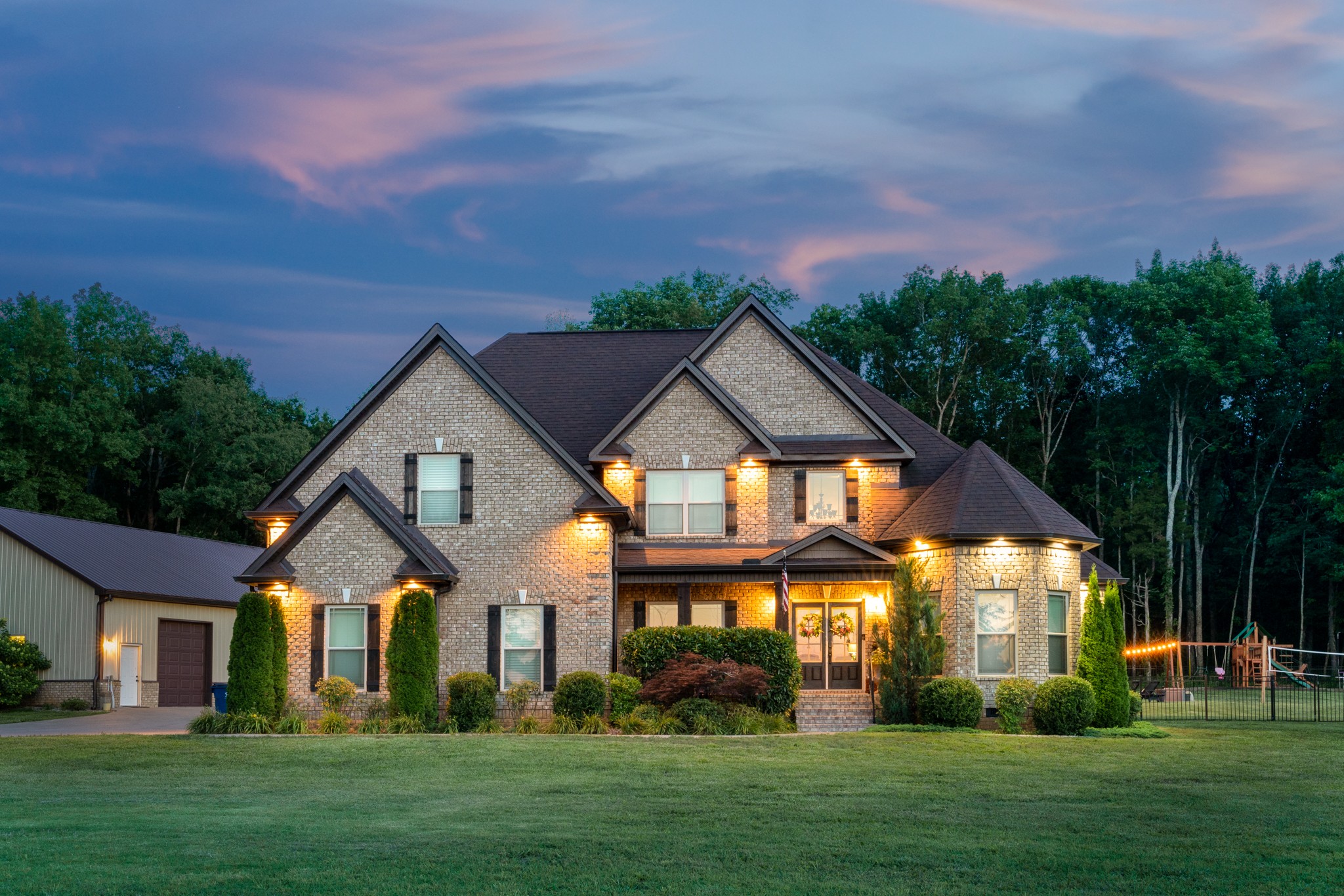 a front view of a house with a yard