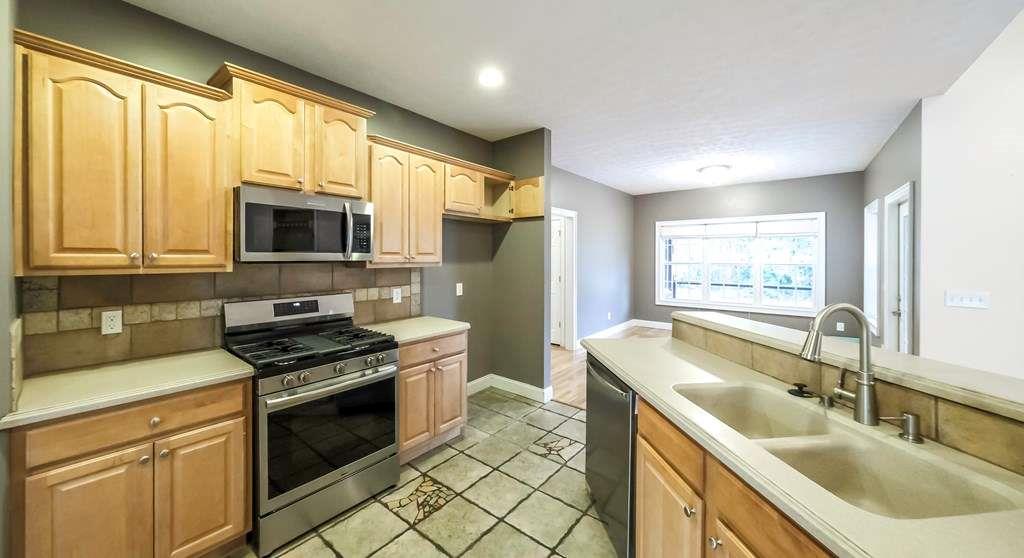111 Watson Drive Bremen, GA 30110 - Photo 11 of 60 a kitchen with stainless steel appliances granite countertop a sink stove and refrigerator
