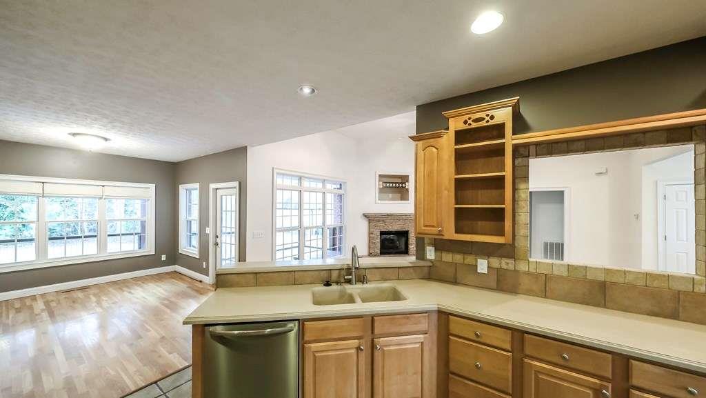111 Watson Drive Bremen, GA 30110 - Photo 12 of 60 a kitchen with a sink stove and cabinets