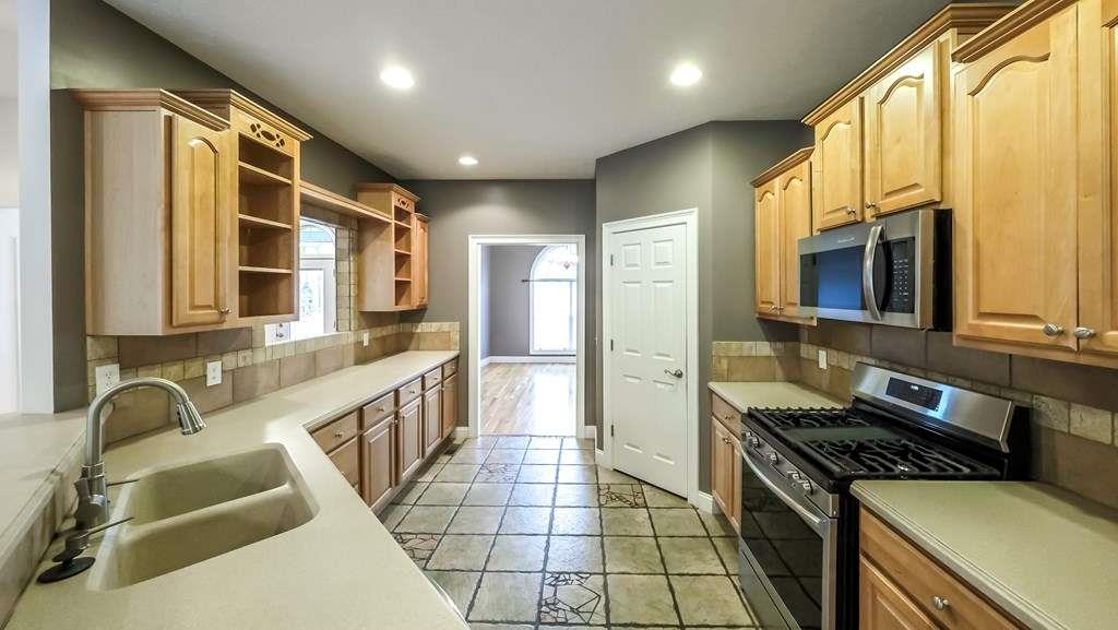 111 Watson Drive Bremen, GA 30110 - Photo 13 of 60 a kitchen with stainless steel appliances granite countertop a stove and a refrigerator