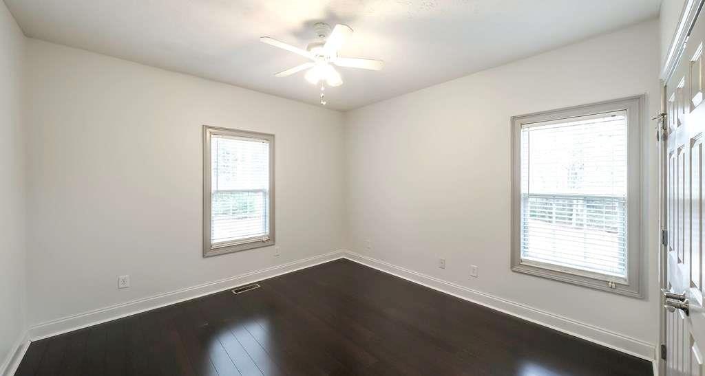 111 Watson Drive Bremen, GA 30110 - Photo 28 of 60 an empty room with wooden floor and windows