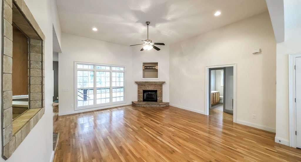 111 Watson Drive Bremen, GA 30110 - Photo 3 of 60 a view of a livingroom with wooden floor fireplace and windows
