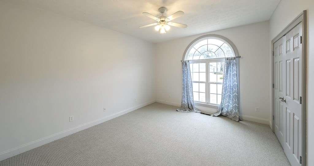 111 Watson Drive Bremen, GA 30110 - Photo 34 of 60 an empty room with windows and ceiling fan