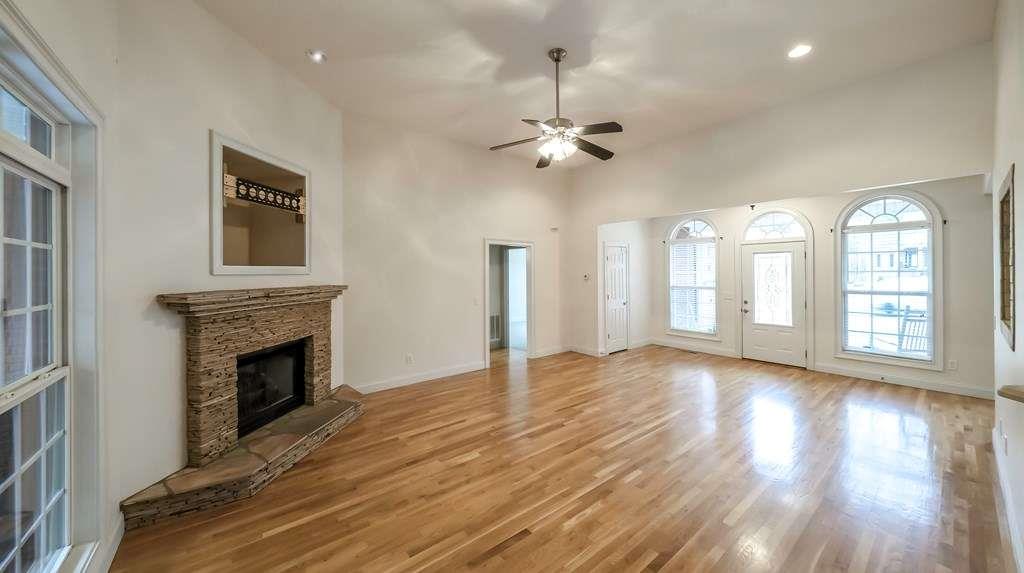 111 Watson Drive Bremen, GA 30110 - Photo 4 of 60 a view of an empty room with wooden floor fireplace and a window