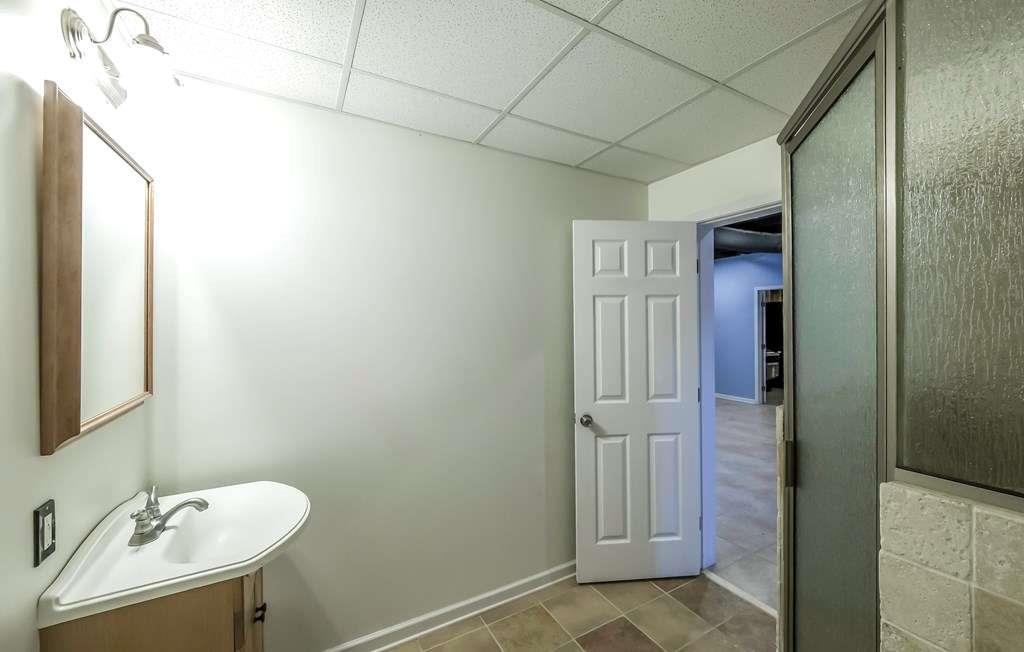 111 Watson Drive Bremen, GA 30110 - Photo 46 of 60 a bathroom with a sink and a mirror