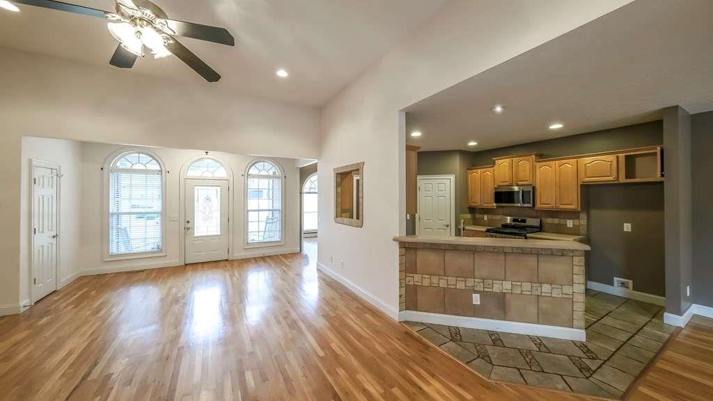 111 Watson Drive Bremen, GA 30110 - Photo 6 of 60 a open kitchen with stainless steel appliances kitchen island granite countertop a refrigerator a stove a sink and a large window with wooden floor