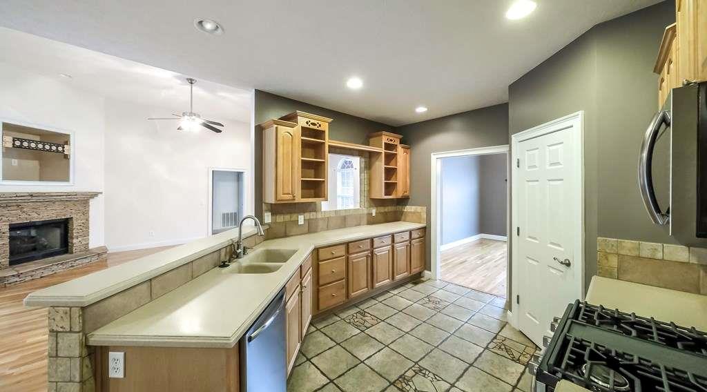 111 Watson Drive Bremen, GA 30110 - Photo 10 of 60 a spacious bathroom with a double vanity sink a mirror and a bathtub