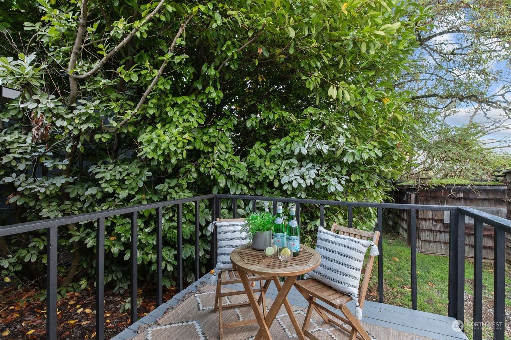 208 South 101st Street Seattle, WA 98168 - Photo 17 of 37 a balcony with wooden floor table and chairs