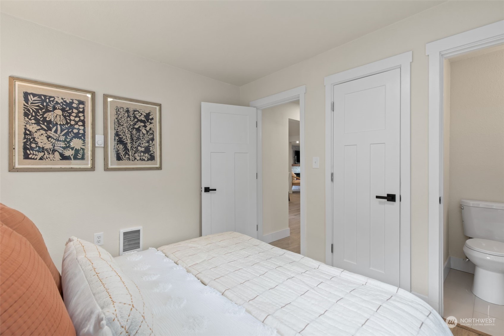 208 South 101st Street Seattle, WA 98168 - Photo 19 of 37 a bedroom with a bed and a view of bathroom