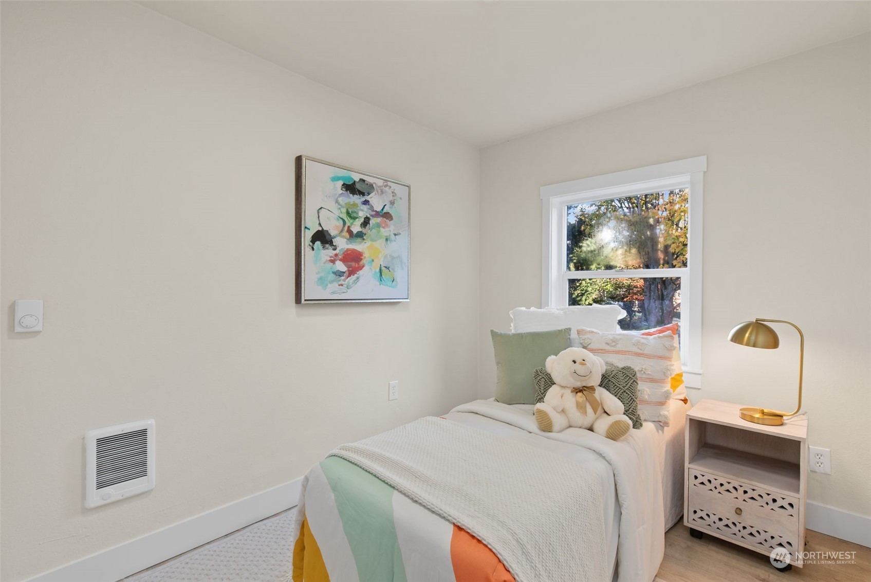 208 South 101st Street Seattle, WA 98168 - Photo 23 of 37 a bedroom with a bed and a painting on the wall
