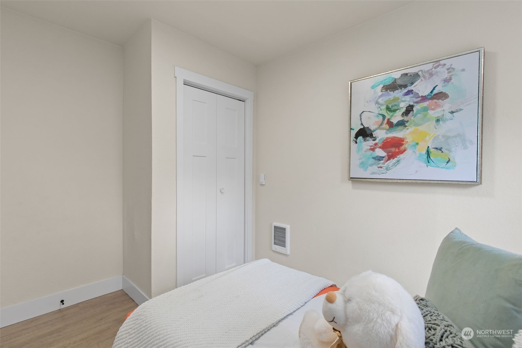 208 South 101st Street Seattle, WA 98168 - Photo 24 of 37 a bedroom with a bed and painting on the wall