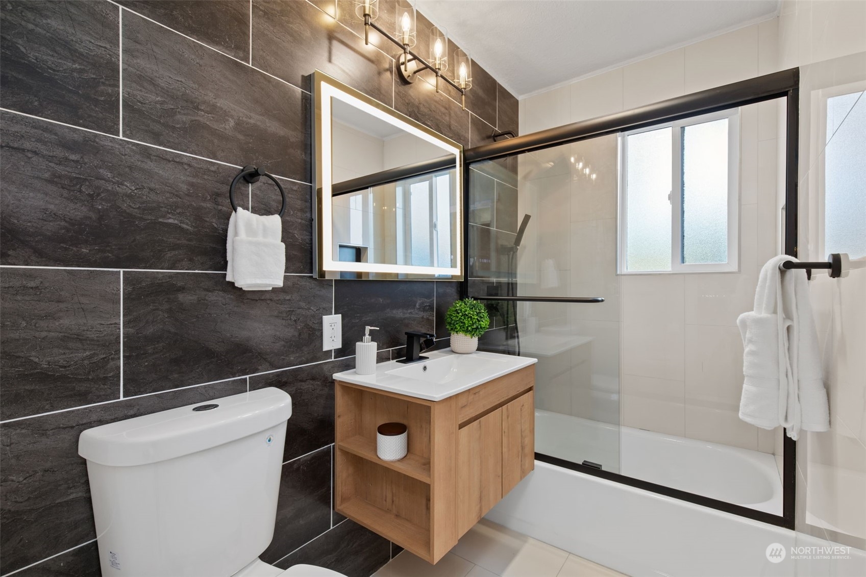 208 South 101st Street Seattle, WA 98168 - Photo 30 of 37 a bathroom with a sink a toilet and shower