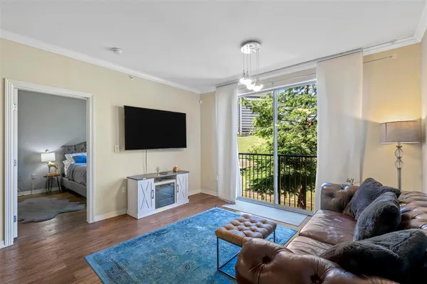 a living room with furniture and a flat screen tv