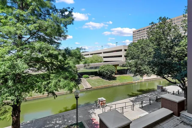 a view of a lake with a yard