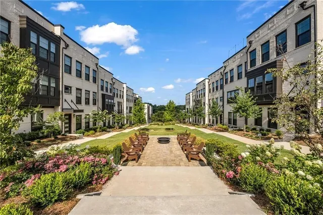 a view of a building with a yard