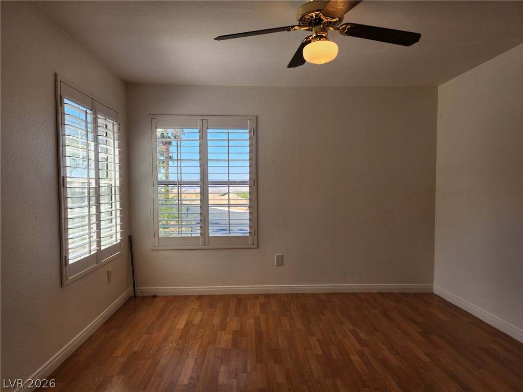231 West Horizon Ridge Parkway, Unit 1127 Henderson, NV 89012 - Photo 21 of 39 Rich hardwood-style flooring and natural light create a welcoming ambiance in this versatile room.