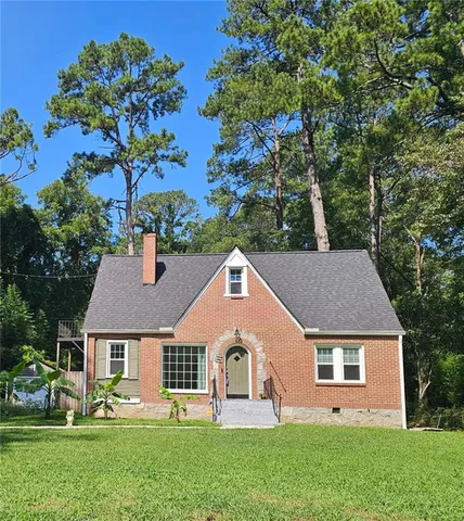 front view of a house with a yard