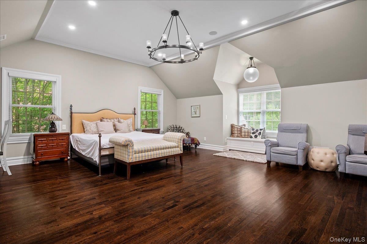 7 Harcourt Road Scarsdale, NY 10583 - Photo 17 of 34 a spacious bedroom with a bed and wooden floor