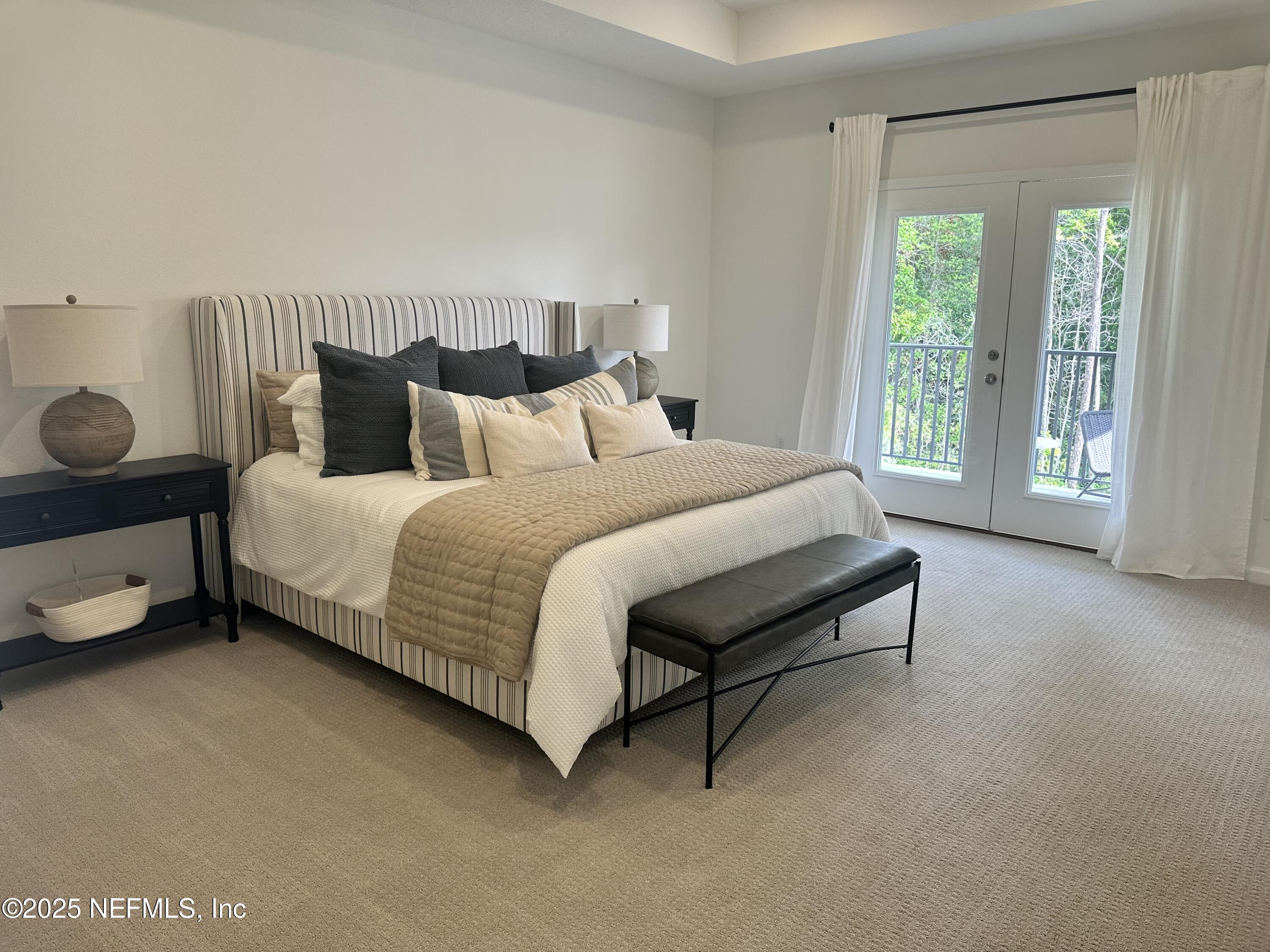 34 Twilight Lane St. Augustine, FL 32095 - Photo 13 of 20 a large bed sitting in a bedroom next to a window