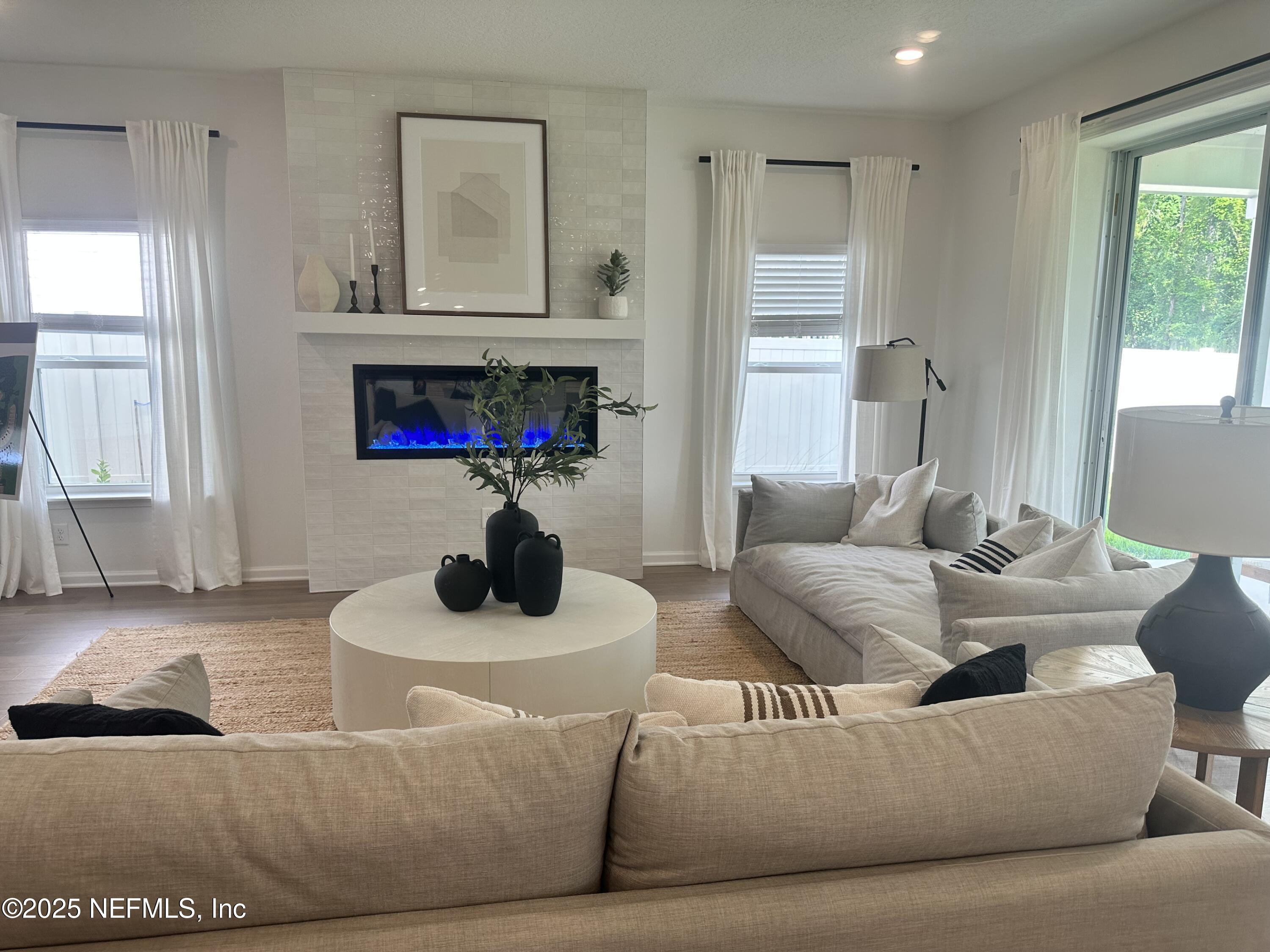 34 Twilight Lane St. Augustine, FL 32095 - Photo 4 of 20 a living room with furniture and a fireplace