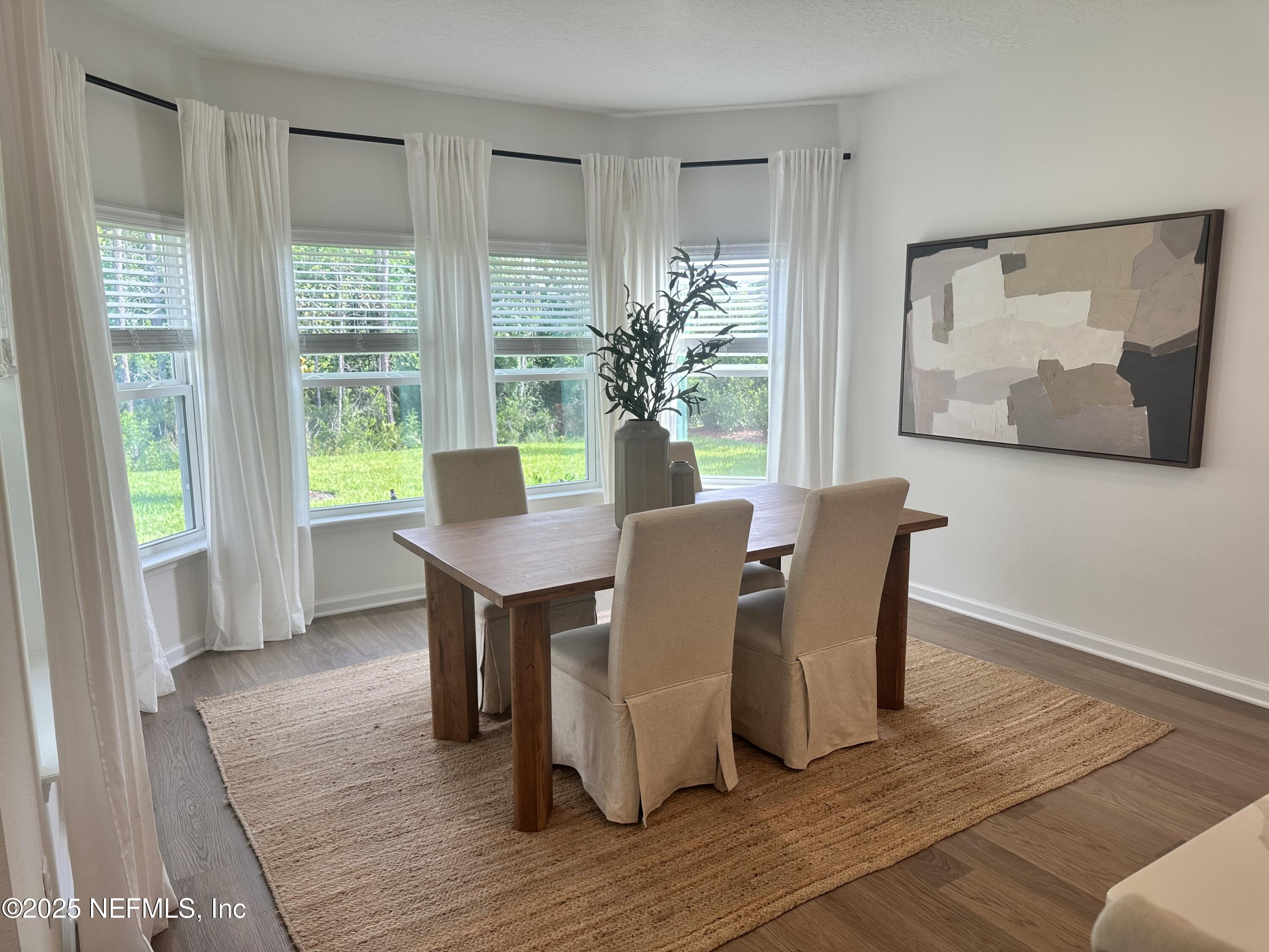 34 Twilight Lane St. Augustine, FL 32095 - Photo 6 of 20 a view of a dining room with furniture and wooden floor