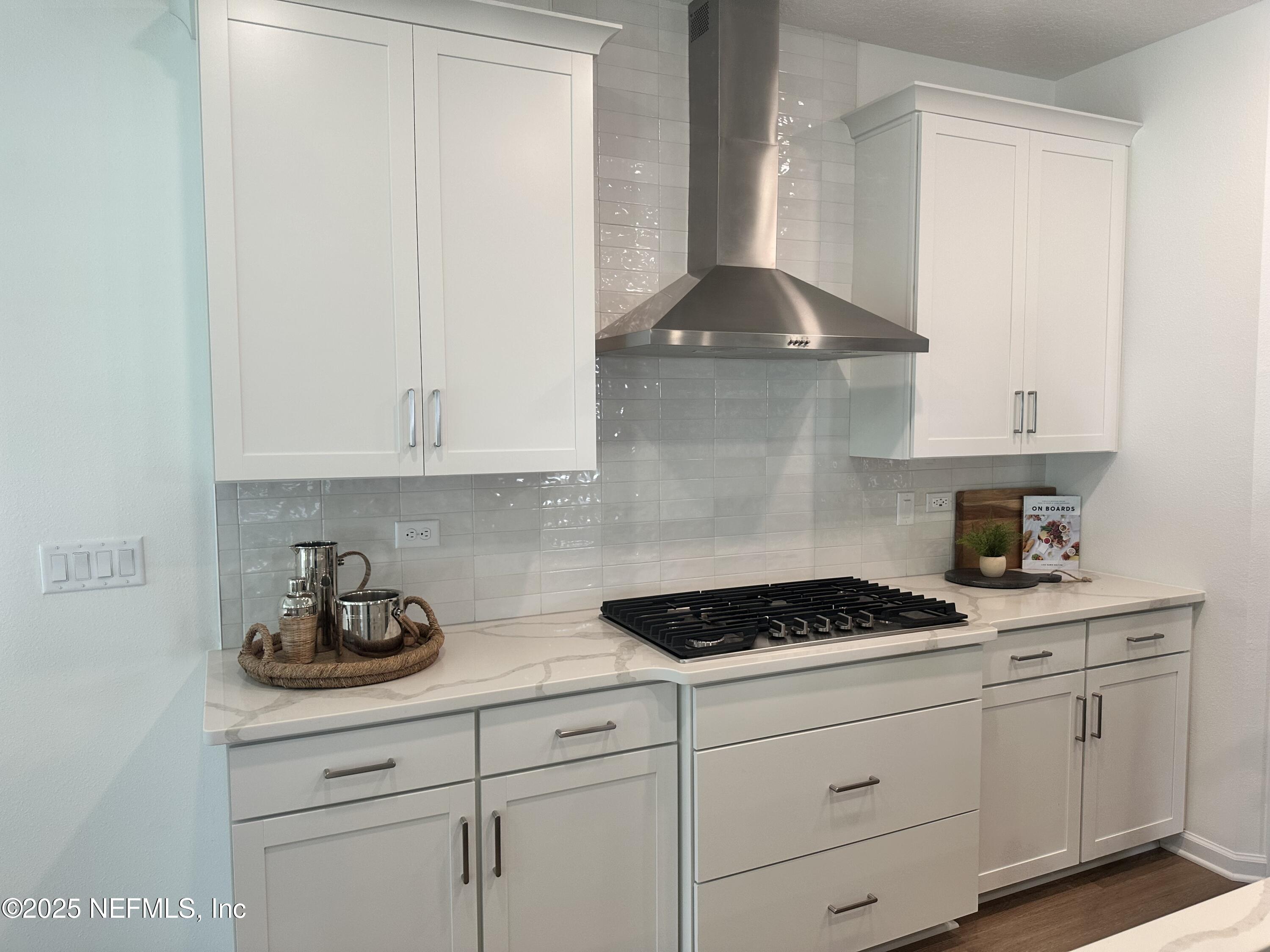 34 Twilight Lane St. Augustine, FL 32095 - Photo 7 of 20 a kitchen with white cabinets and a stove