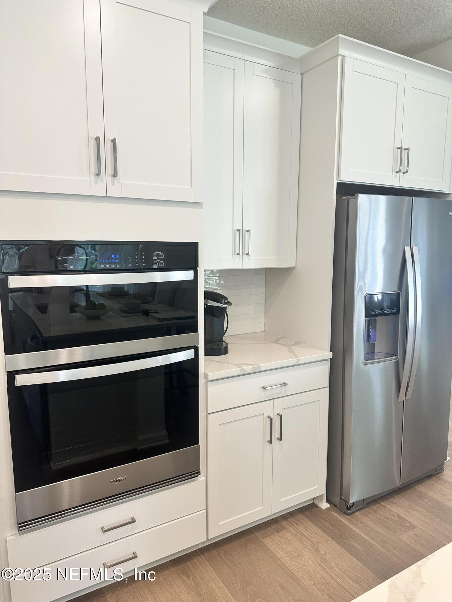 34 Twilight Lane St. Augustine, FL 32095 - Photo 8 of 20 a kitchen with granite countertop white cabinets and stainless steel appliances