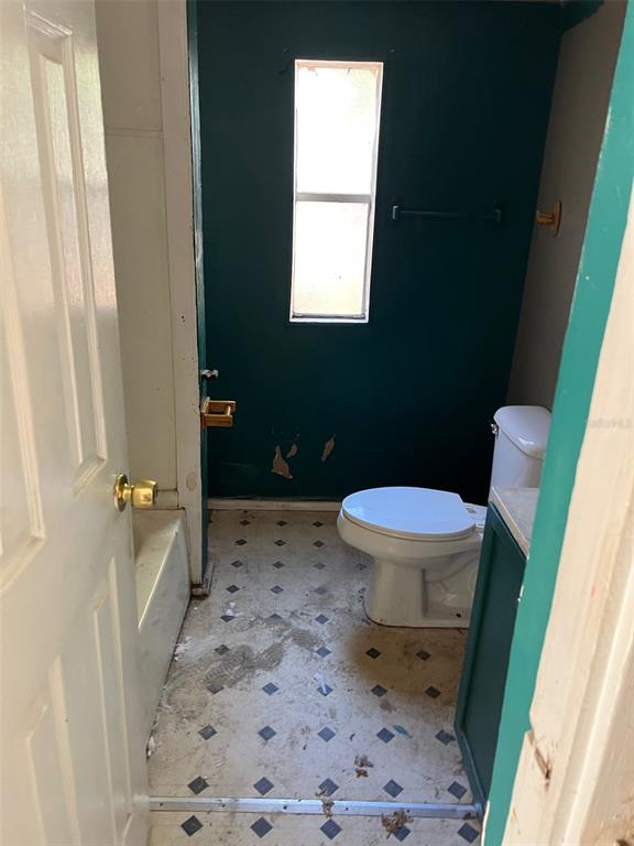 6631 Celeste Lane New Port Richey, FL 34653 - Photo 11 of 13 a bathroom with a toilet and a shower