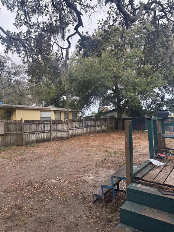 6631 Celeste Lane New Port Richey, FL 34653 - Photo 13 of 13 a view of a yard with plants