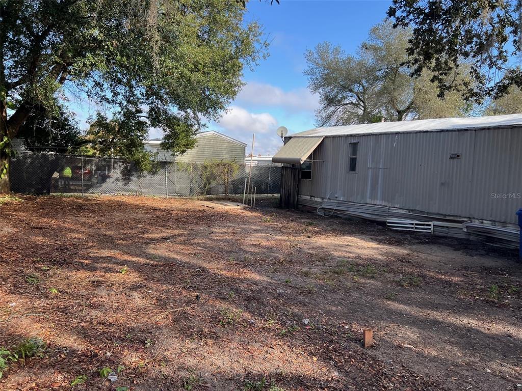 6631 Celeste Lane New Port Richey, FL 34653 - Photo 3 of 13 a backyard of a house