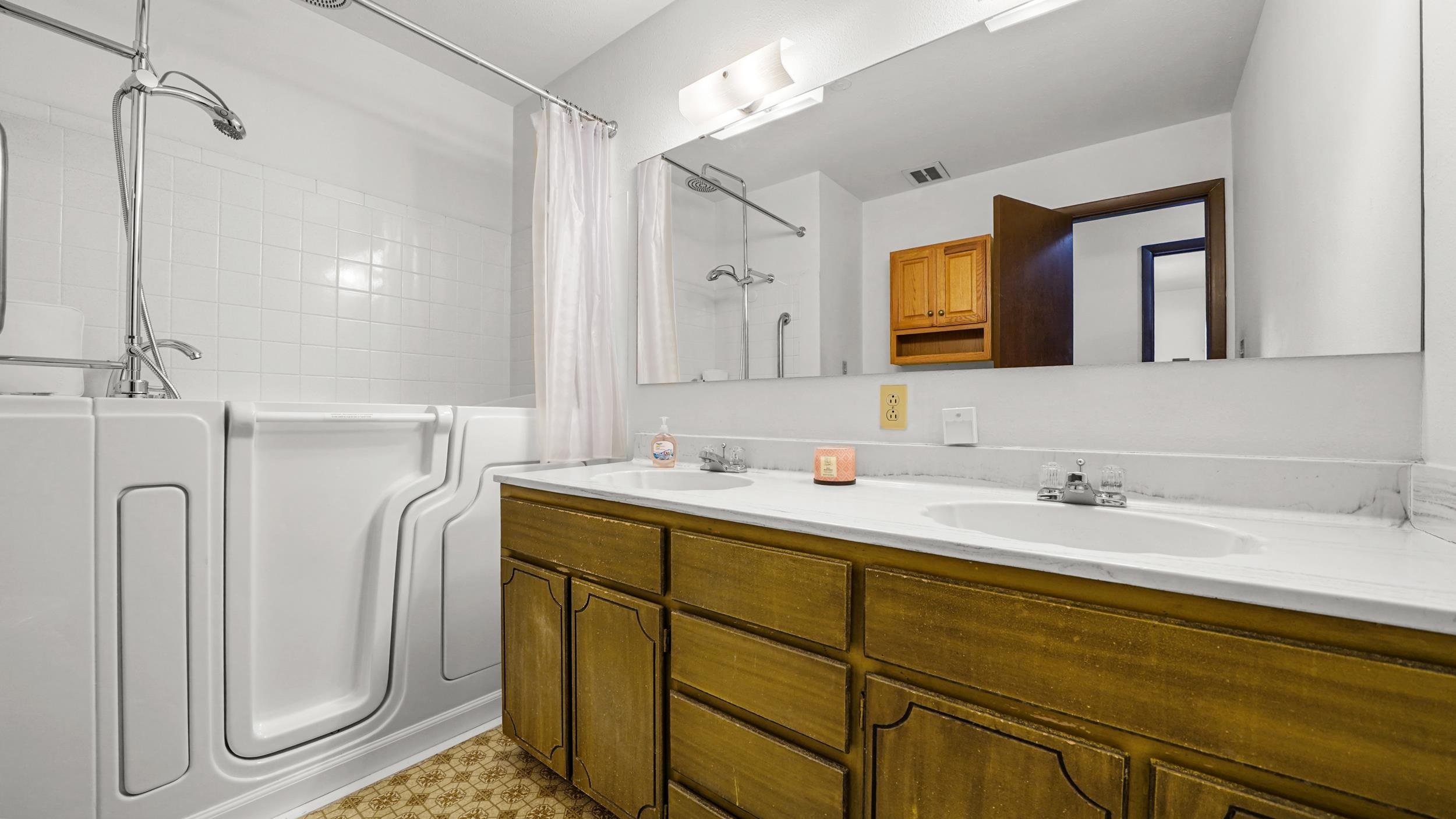 582 36 Road Palisade, CO 81526 - Photo 16 of 31 a bathroom with a double vanity sink mirror and