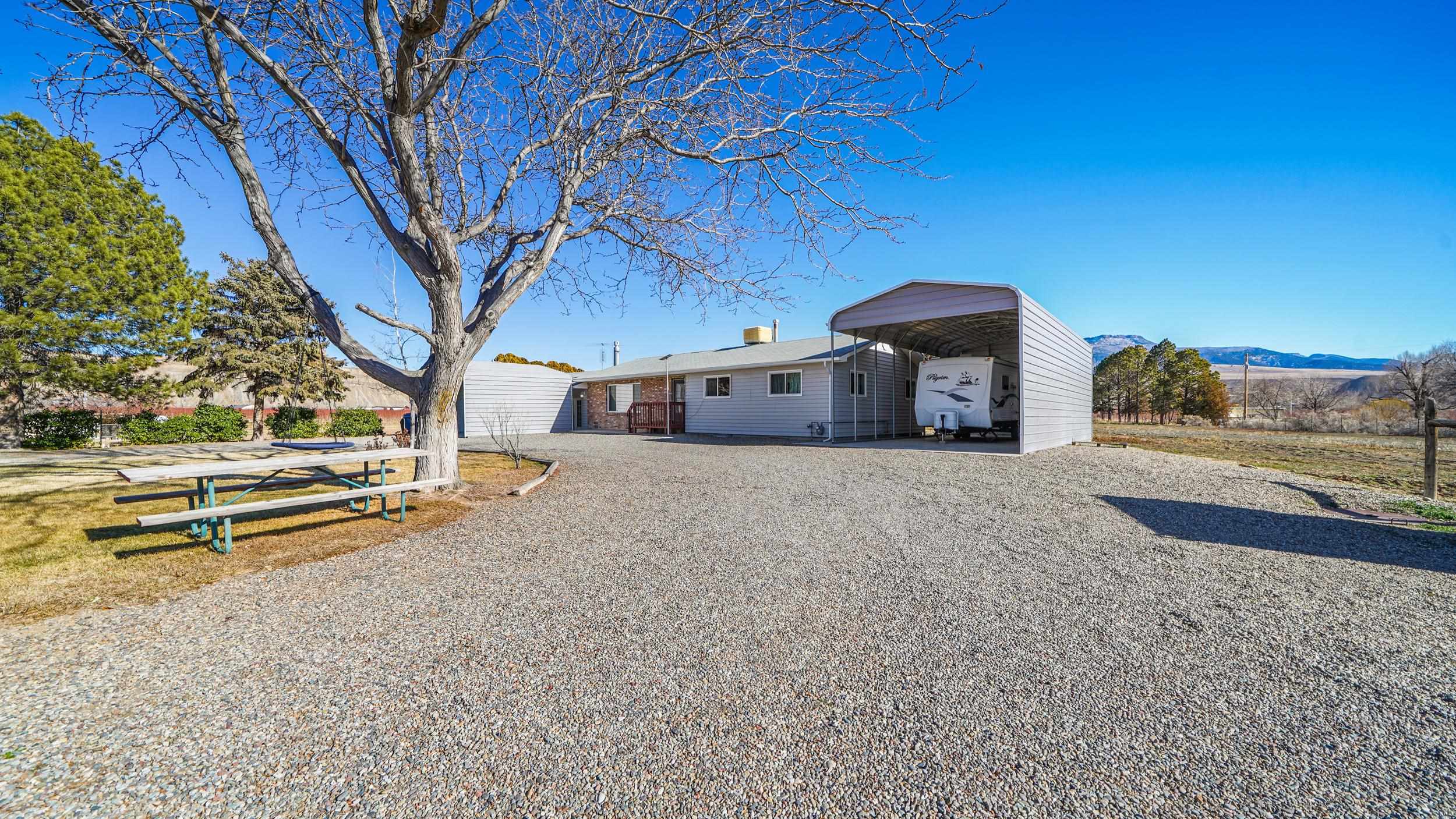 582 36 Road Palisade, CO 81526 - Photo 22 of 31 a view of a house with a yard