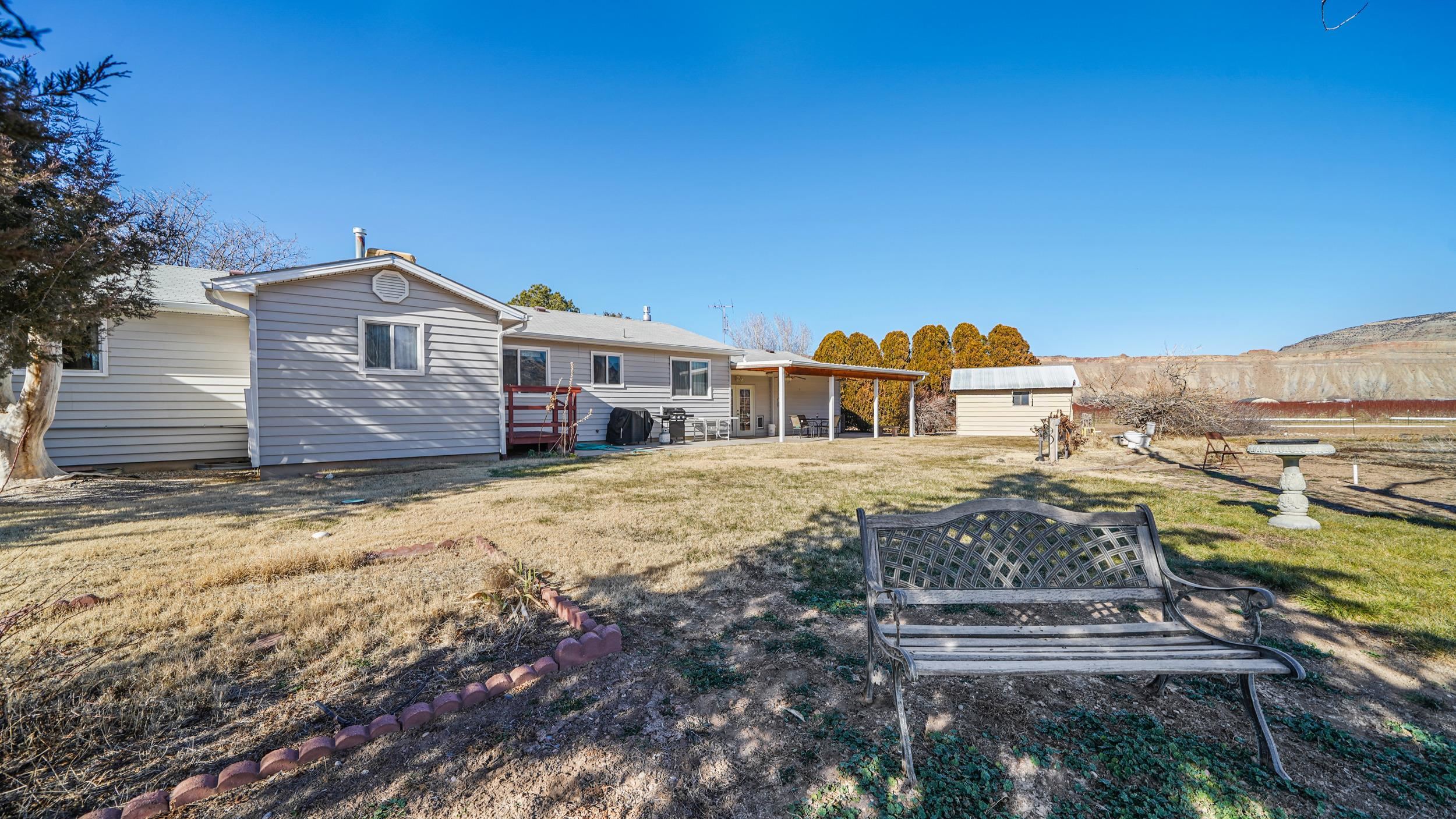 582 36 Road Palisade, CO 81526 - Photo 24 of 31 a front view of a house with a yard