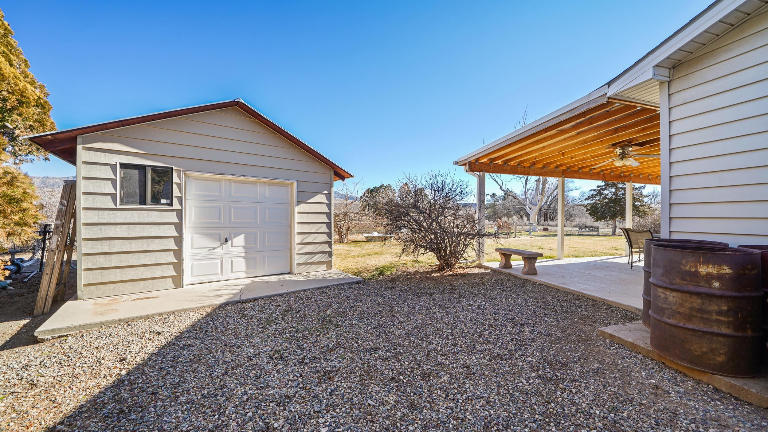 582 36 Road Palisade, CO 81526 - Photo 26 of 31 a view of a house with backyard and sitting area