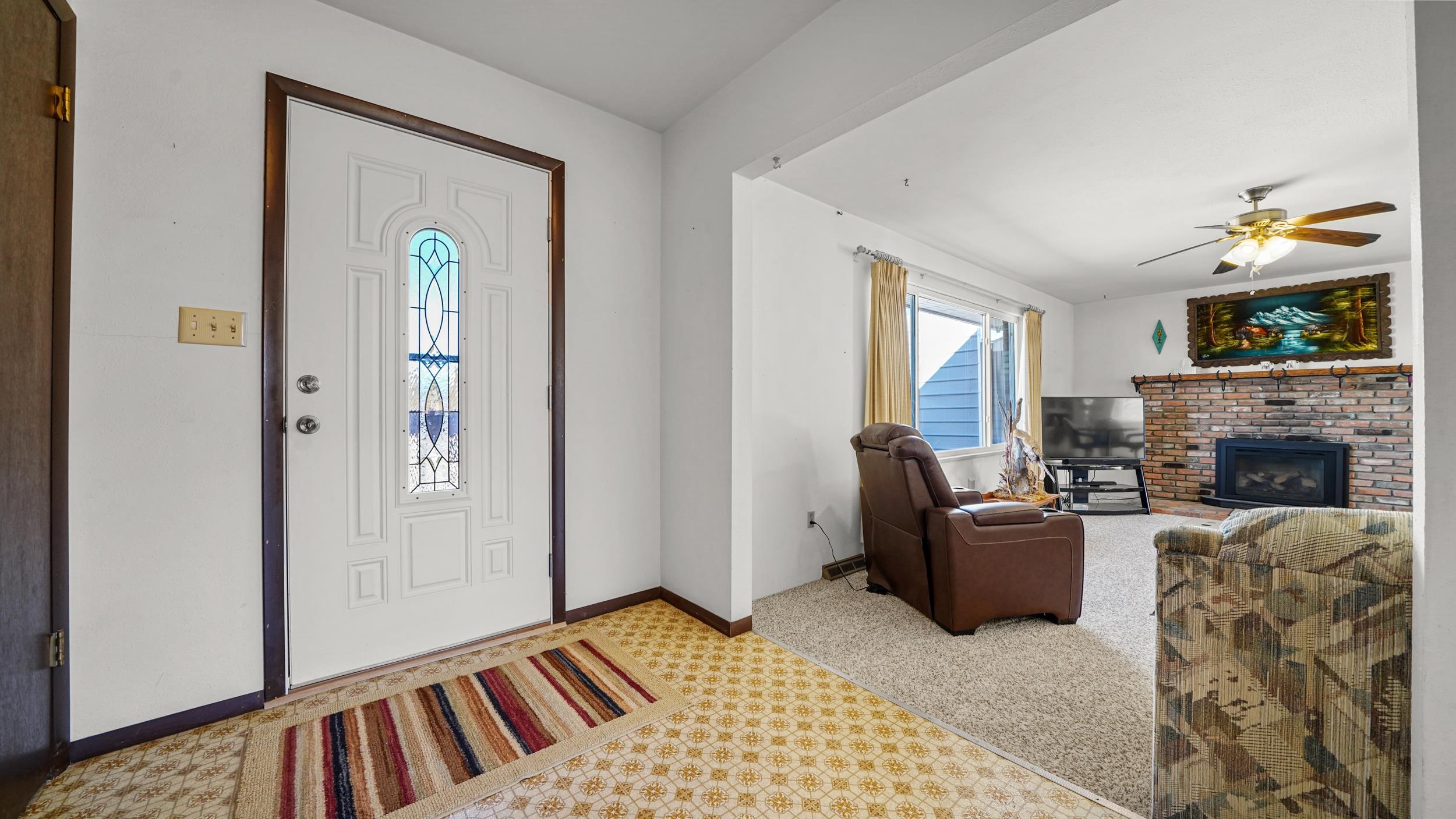 582 36 Road Palisade, CO 81526 - Photo 3 of 31 a bedroom with furniture and a fireplace