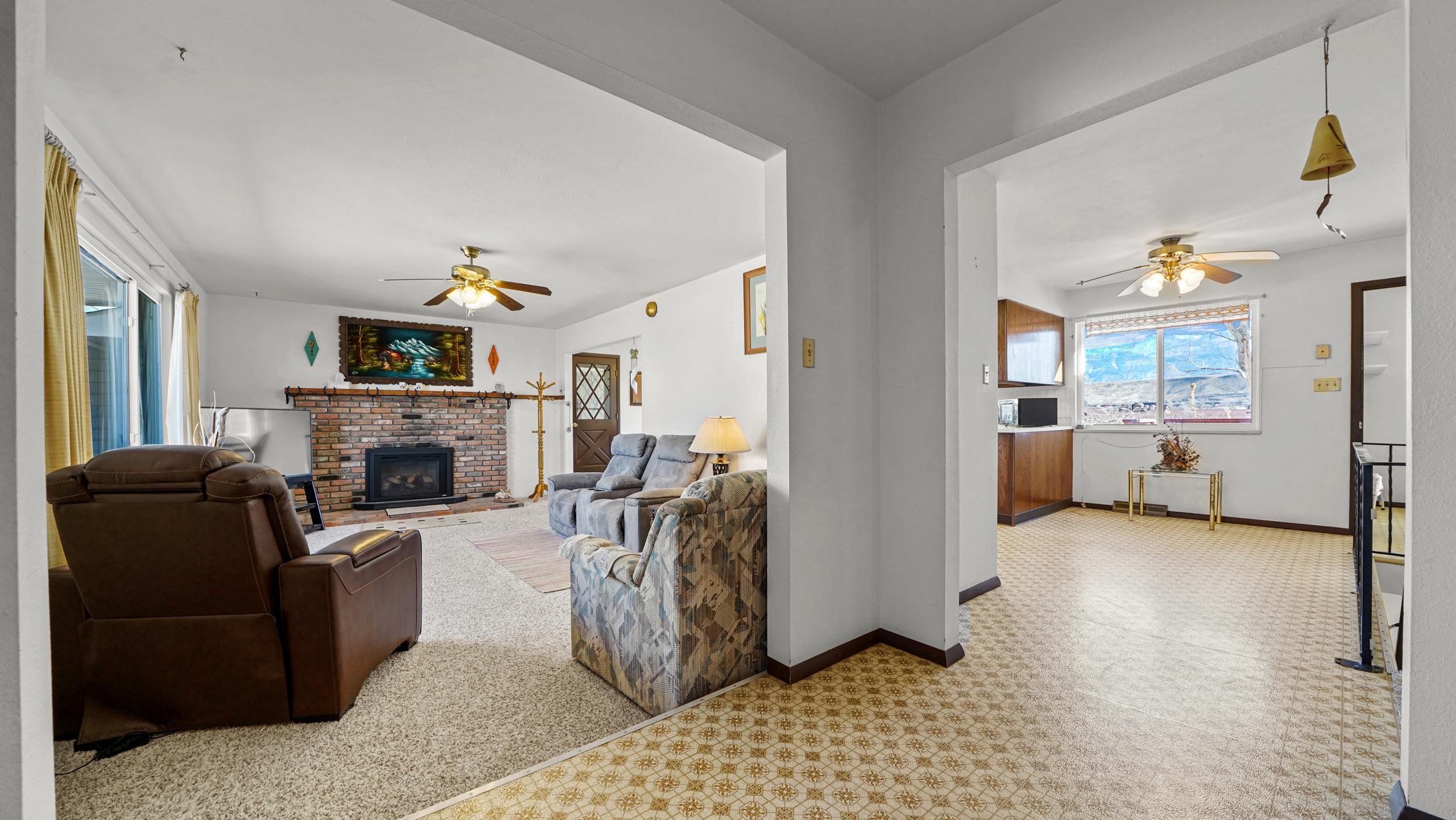 582 36 Road Palisade, CO 81526 - Photo 4 of 31 a living room with furniture and a fireplace