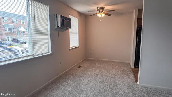 en empty room with windows