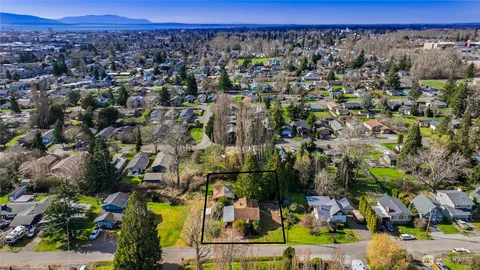 an aerial view of residential house with outdoor space and mountain view