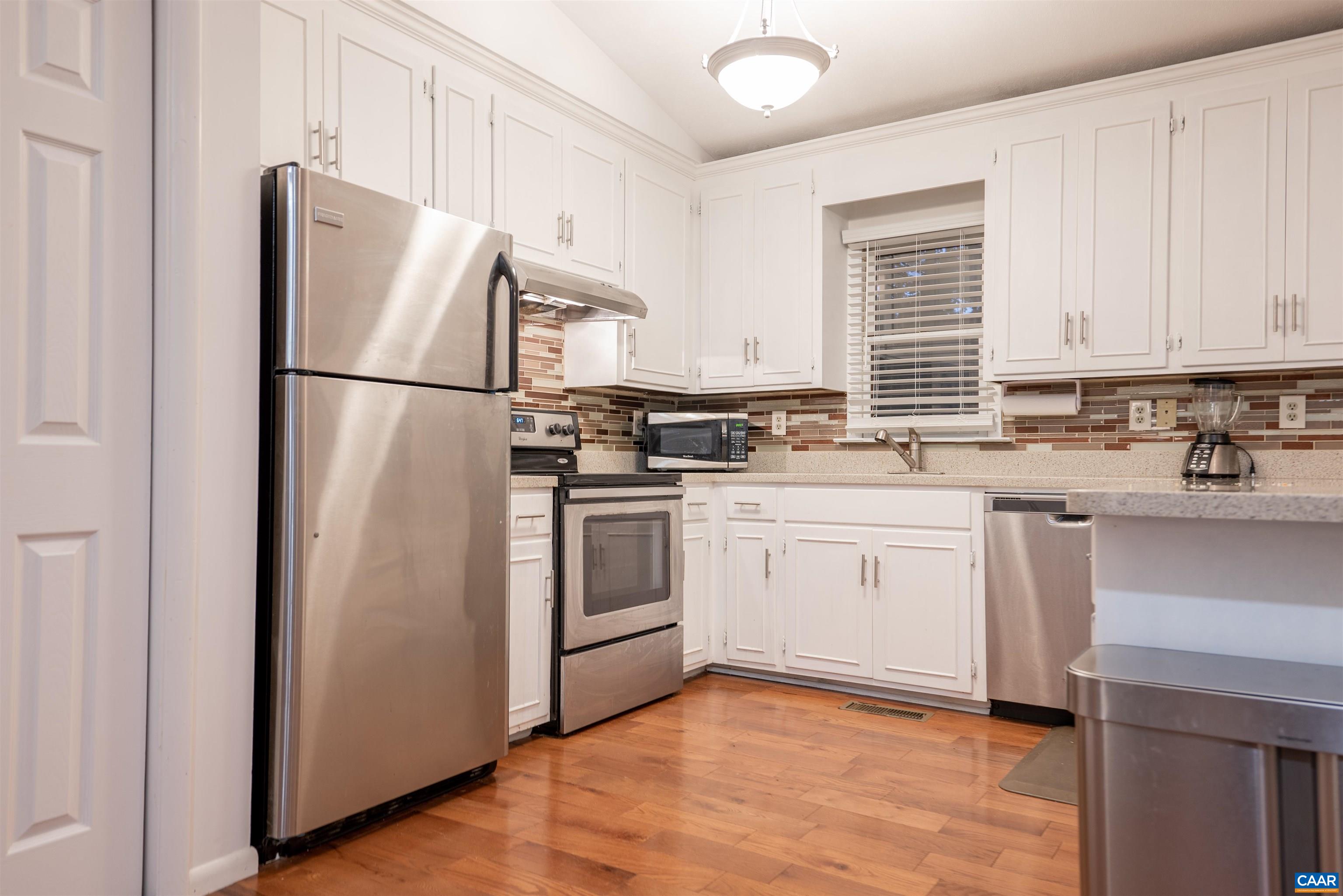 21 Rowell Road Palmyra, VA 22963 - Photo 14 of 30 a kitchen with white cabinets white stainless steel appliances and sink