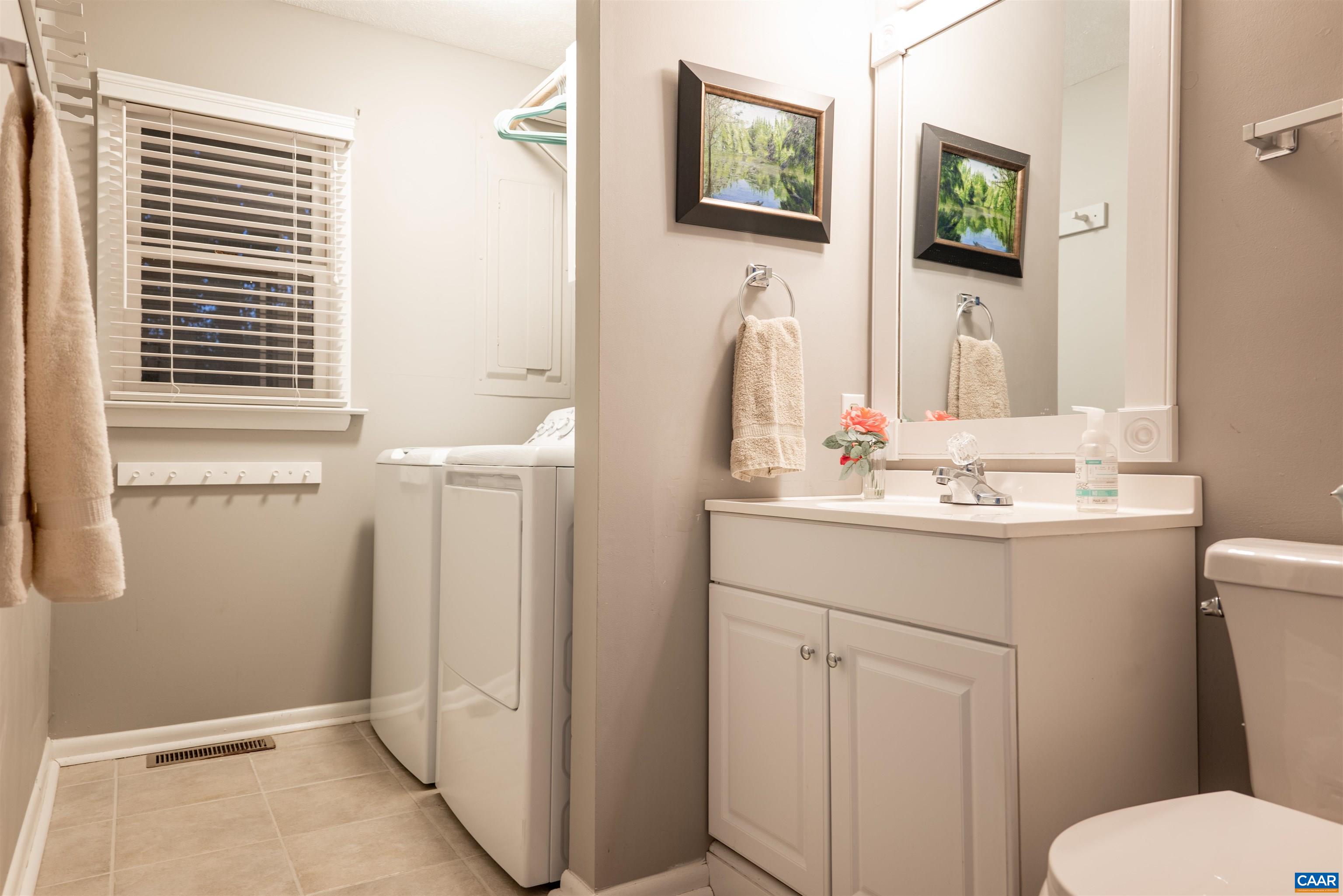 21 Rowell Road Palmyra, VA 22963 - Photo 20 of 30 a bathroom with a sink a toilet and mirror