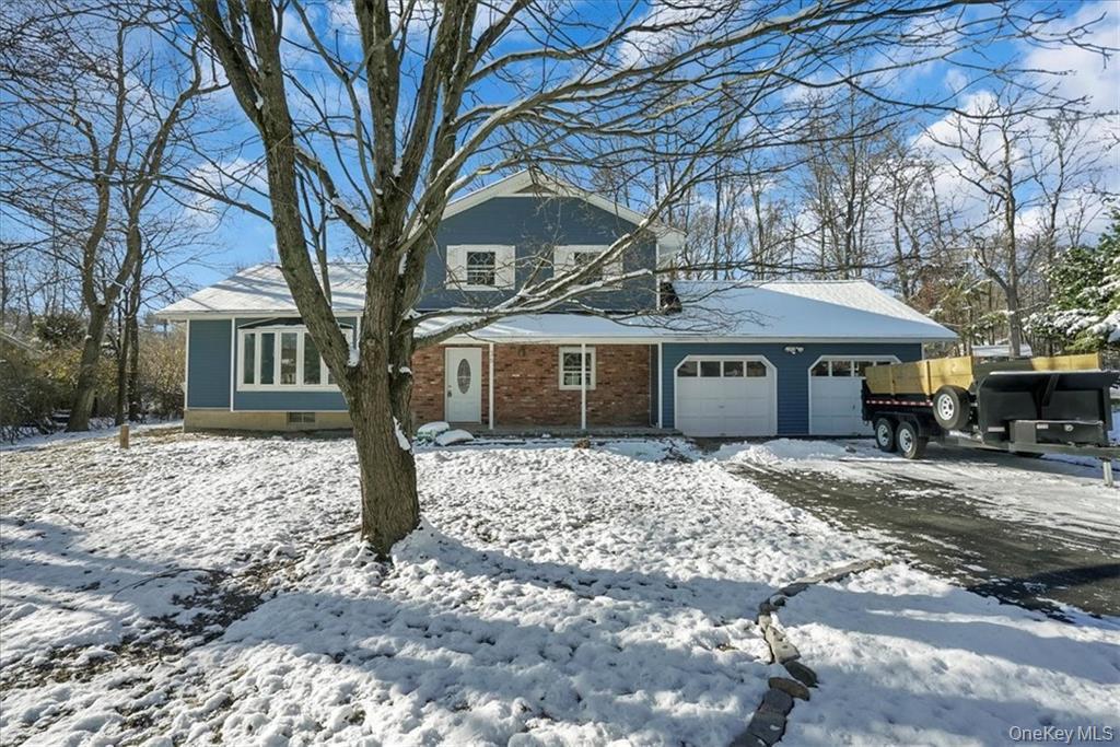36 Ironworks Road Monroe, NY 10950 - Photo 5 of 37 View of front of property with an attached garage and brick siding